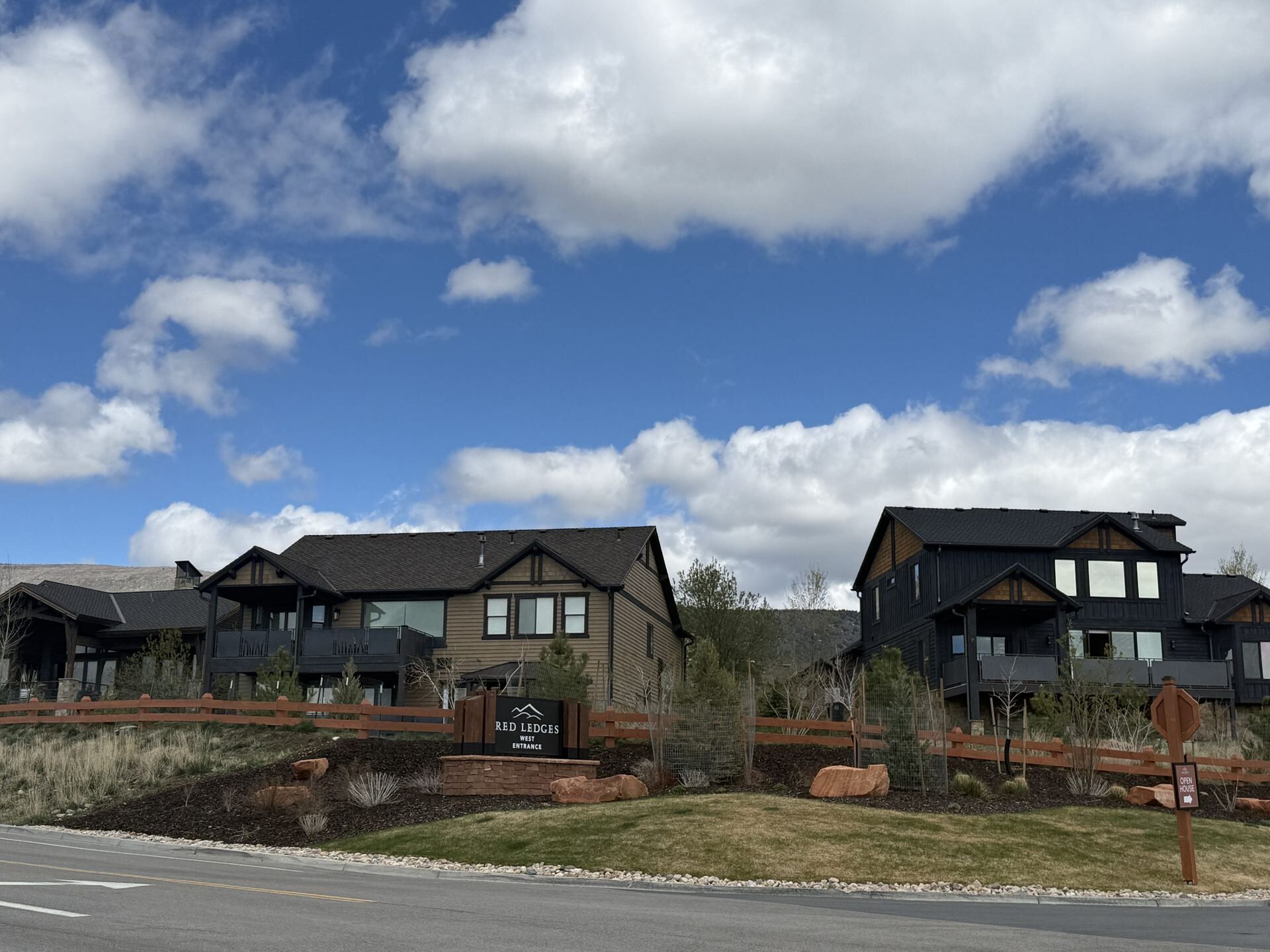Red Ledges community entrance and dark-stained luxury mountain homes in Heber City Utah