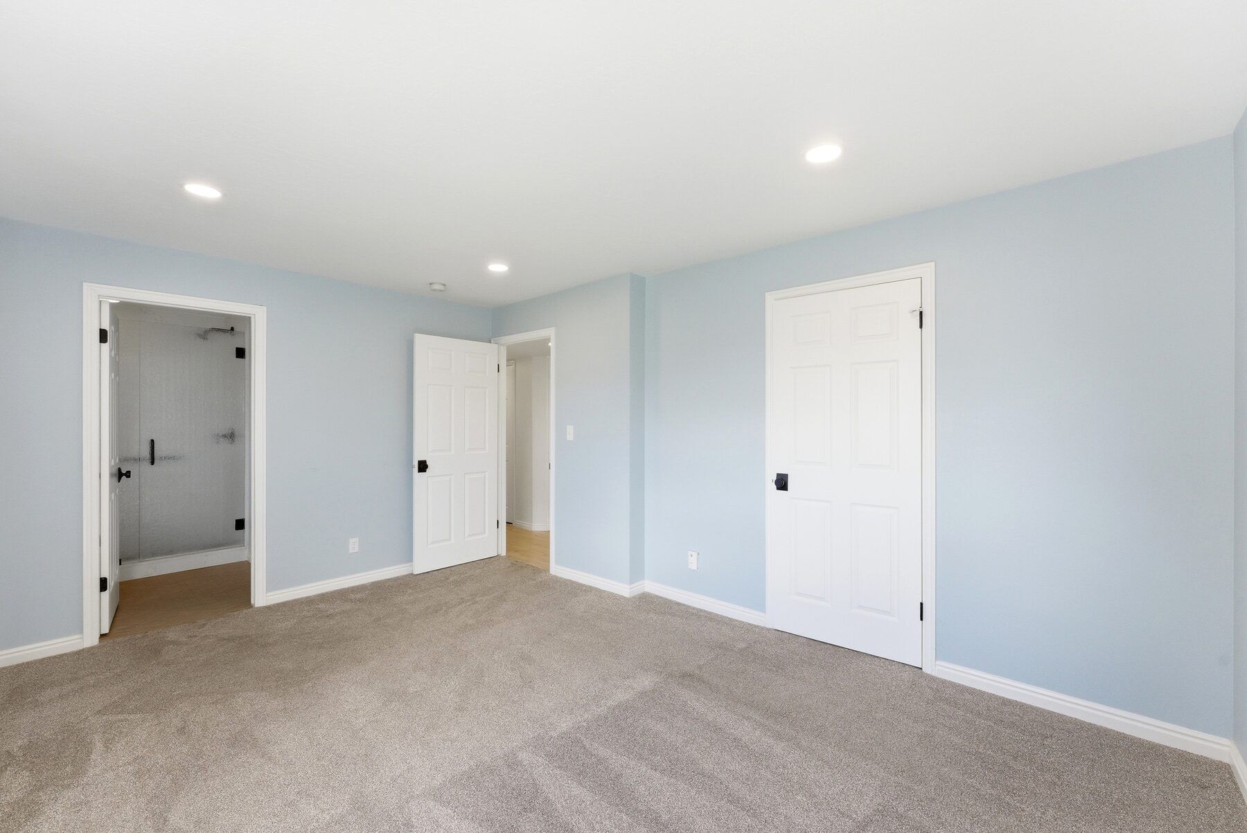 Main-level primary bedroom in single-level Swiss Oaks condo Midway Utah