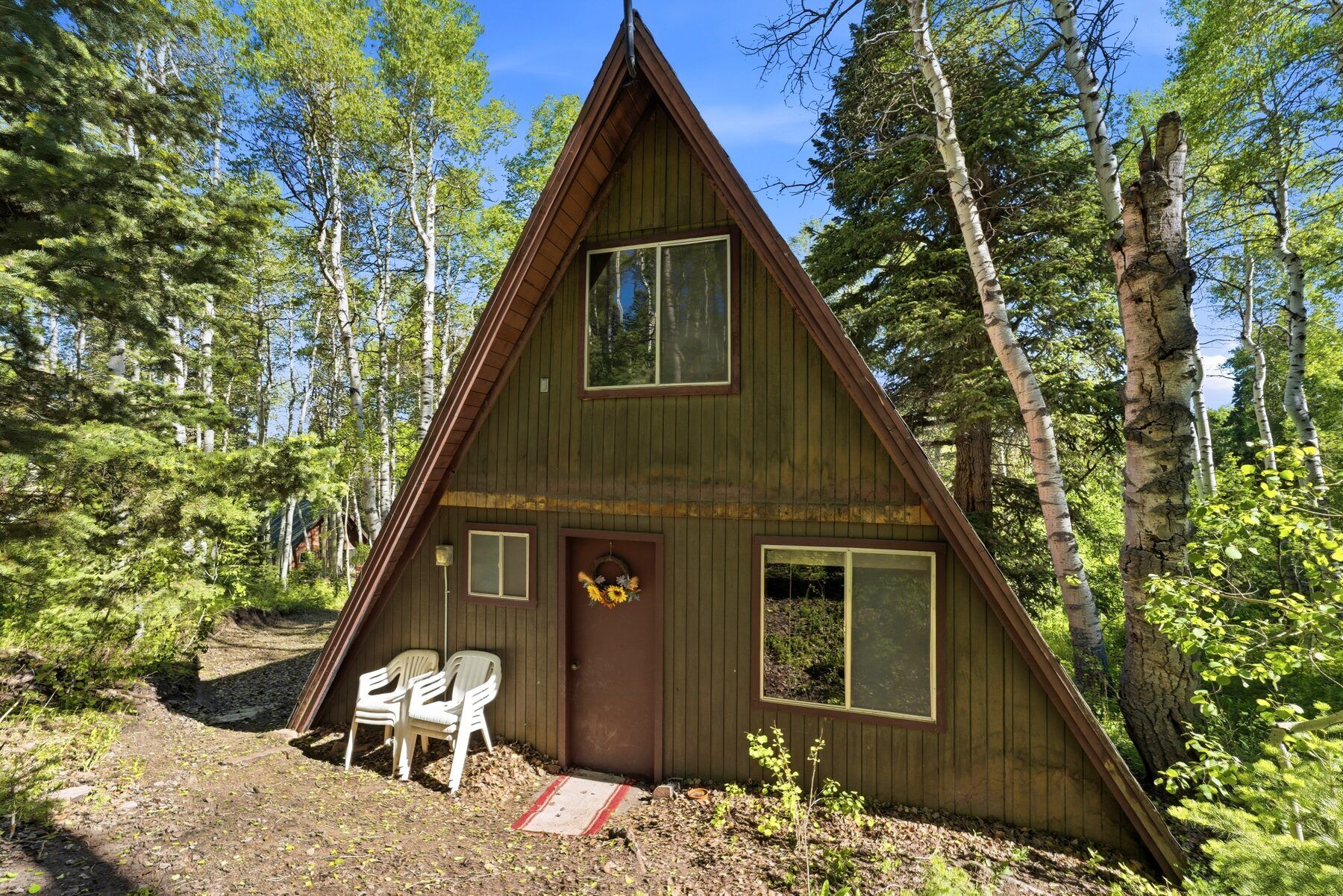 Heber City A-frame cabin with back deck set among pine and aspen trees